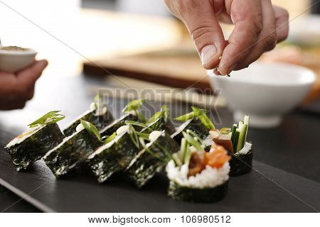 Classic thick rolls futomaki served on a stone plate