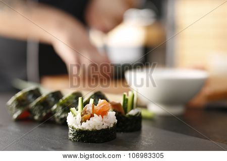 Classic thick rolls futomaki served on a stone plate