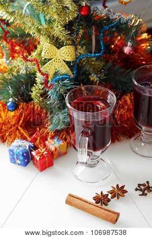 mulled wine with decorated christmas tree