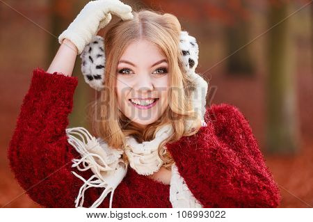 Portrait Of Pretty Smiling Woman In Fur Earmuffs.