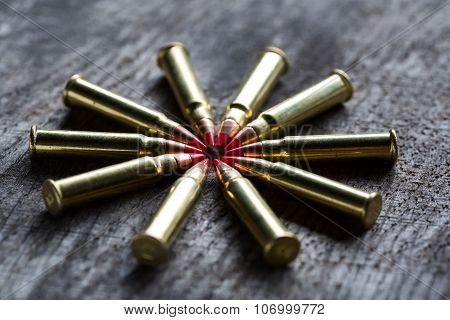 Macro shot of small-caliber tracer rounds with a red tip