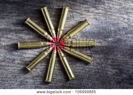 Macro shot of small-caliber tracer rounds with a red tip