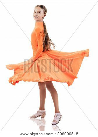Little dancer girl in beautiful bright ballroom dress isolated on white background