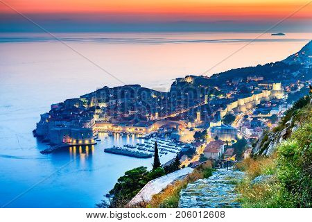 Dubrovnik Croatia and twilight picturesque view on the old town of Ragusa on Dalmatian Coast at Adriatic Sea.