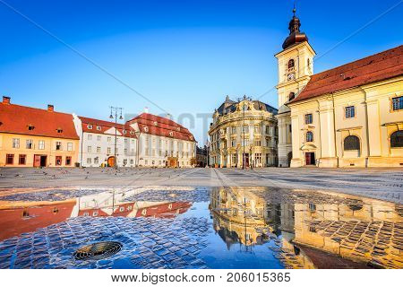 Sibiu Romania - Large Square with water reflexion. Transylvania saxon city.