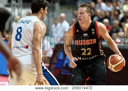 ST. PETERSBURG, RUSSIA - AUGUST 6, 2017: Dmitry Kulagin, Russia and Lior Eliyahu, Israel in action during basketball match Russia (black) vs Israel (white) for Kondrashin-Belov Cup. Israel won 79-71