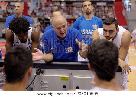 ST. PETERSBURG, RUSSIA - AUGUST 6, 2017: Israel national basketball team coach Erez Edelstein gives instructions to the players in the basketball match against Russia during Kondrashin-Belov Cup