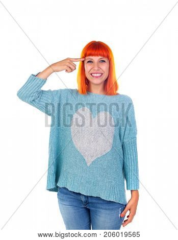 Redhead girl with blue jersey doing a signal of crazy with her finger isolated on white background