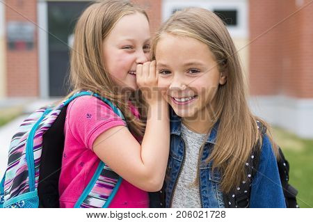 The Great Portrait Of School Pupil Outside Classroom Carrying Bags