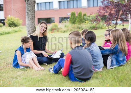 The Great Portrait Of School Pupil Outside Classroom Carrying Bags