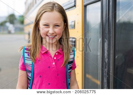 The Great Portrait Of School Pupil Outside Classroom Carrying Bags