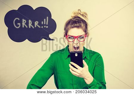 Angry Business Woman Looking At Phone, Thinking Bubble
