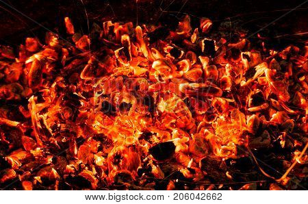 background of burning coals . Photo of an abstract texture