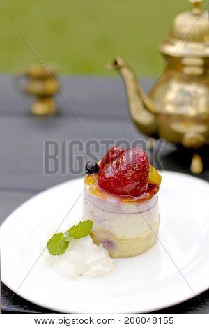 close up Cake strawberries and tea pot