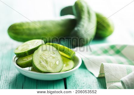 Sliced green cucumbers. Cucumbers in bowl.