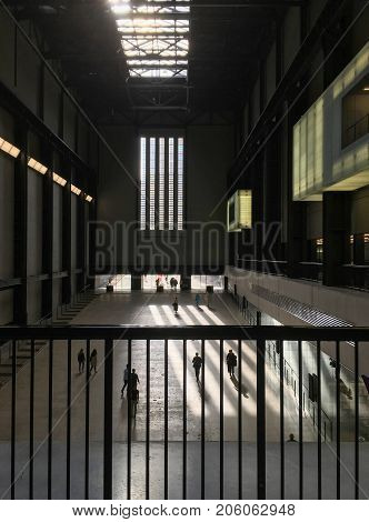 LONDON, UK - MAY 23, 2017: People walk inside Tate Modern Gallery in London, UK. Tate Modern is one of the largest museums of modern and contemporary art in the world.