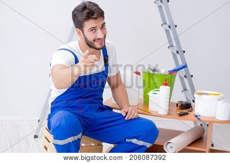 Repairman doing renovation repair in the house with paper wallpa