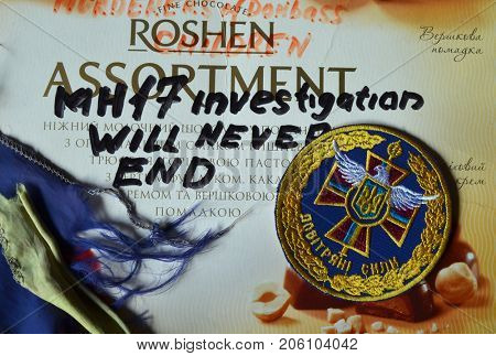 ILLUSTRATIVE EDITORIAL. Chevron of Ukrainian Army. With logo Roshen Inc. Trademark Roshen is property of Ukrainian president Poroshenko. MH17 flight investigation. Kiev,Ukraine.September 10, 2017
