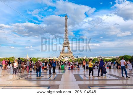 PARIS,FRANCE - JULY 30,2017 : The Tour Eiffel and tourists at the Palace de Chaillot in Paris