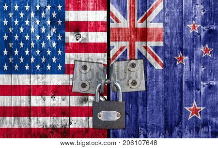 US and New Zeland flag on door with padlock