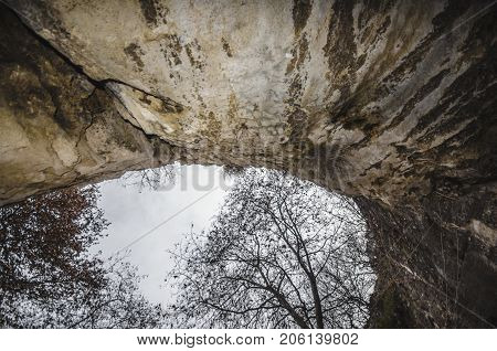 Rocky Cave With Trees Overlooking To The Sky. Gazakh Damcili Azerbaijan