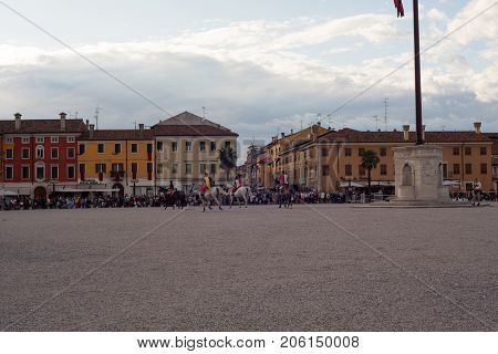 PALMANOVA ITALY - SEPTEMBER 03: Men dressed in ancient clothes riding horses during the historical Reenactment a.d. 1615 on September 03 2017