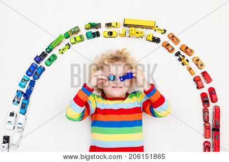 Little Boy Playing With Toy Cars. Toys For Kids.