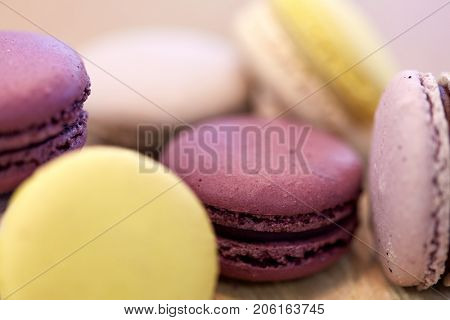 cooking, confectionery and baking concept - close up of macarons