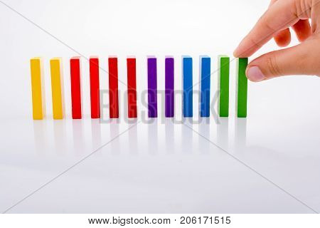 Hand Holding Color Dominoes