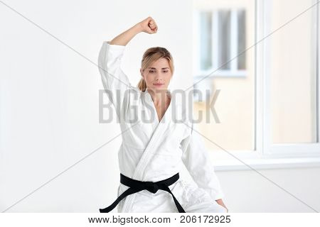 Female karate instructor training in dojo