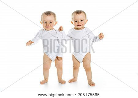 The Two identical twins on a white isolated background