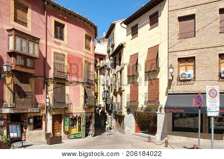 TOLEDO,SPAIN - AUGUST 8,2017 : Restaurants and handicraft shops in the medieval city of Toledo in Spain