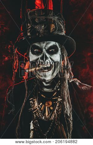 Baron Saturday. Baron Samedi. A man with a skull makeup dressed in a tail-coat and a top-hat. Dia de los muertos. Day of The Dead. Halloween.