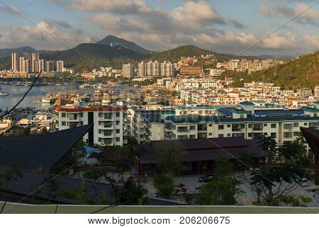 Sanya, China - April 07, 2017: Evening view of Sanya from the top of a hill in a Luhuitou Park