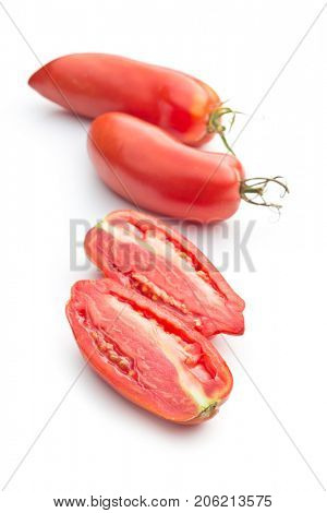 Halved San marzano tomatoes isolated on white background.