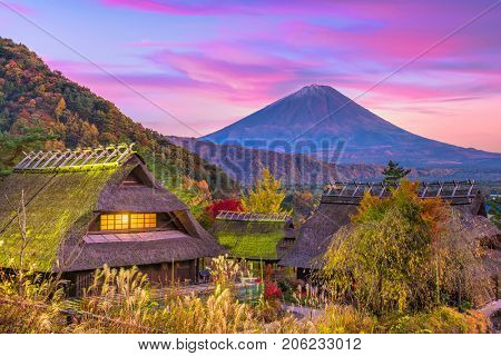 Mt. Fuji, Japan and historic village during an autumn twilight.