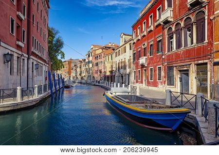 View of The Venice Street And Canal with boats in Venice At Suuny Day, Italy. 