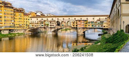 High resolution panotamic view of the Ponte Vecchio, a medieval bridge over the river Arno in the city of Florence, Italy