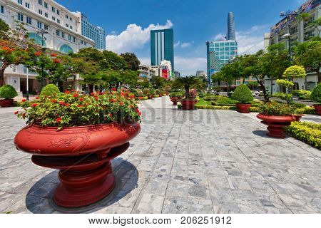 HO CHI MINH, VIETNAM - APRIL 28, 2014: View at one of central streets of Ho Chi Min city with Bitexco Financial Tower on background. Its construction was completed in 2010.