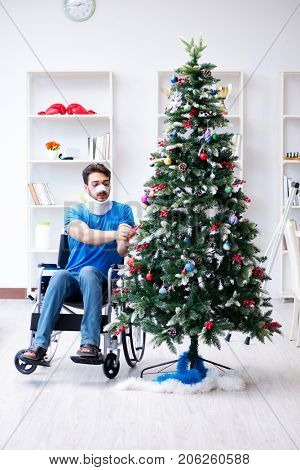 Injured disabled man celebrating christmas at home