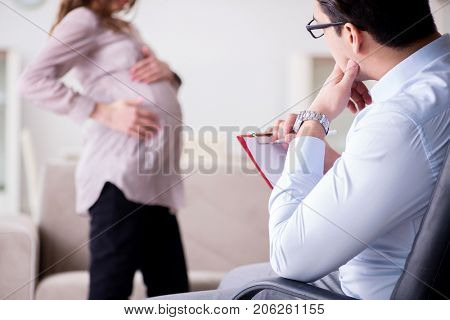 Pregnant woman visiting psychologist doctor
