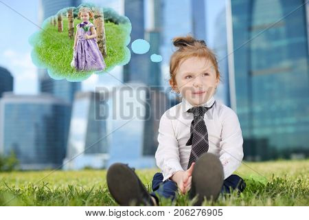 Little cute dreaming girl in tie on grass near skyskrapers, collage - dream about princess dress