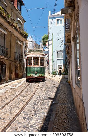Old Tram Number 28 On The Narrow Street Of Alfama. Lisbon. Portugal