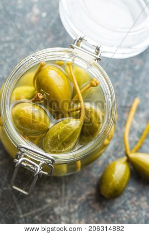 Pickled caper berries in jar. Top view