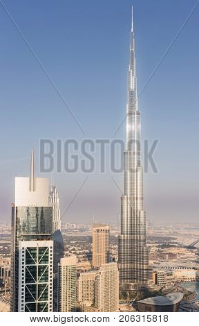 DUBAI, UAE - JAN 9, 2017: Millenium Tower and Burj Khalifa, Burj Khalifa - skyscraper in height of 828 meters in Dubai, tallest structure in world