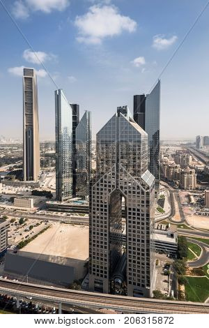 DUBAI, UAE - JAN 8, 2017: Dusit Thani Dubai Hotel and other skyscrapers, Dusit Thani Dubai is located on Sheikh Zayed Road, in the heart of Dubai financial district, close to the World Trade Center