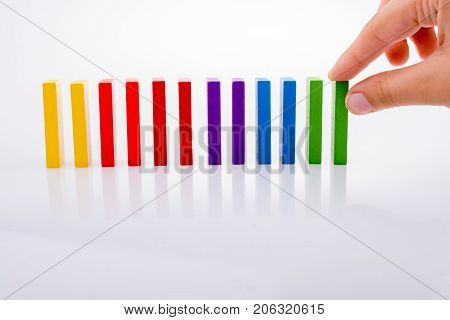 Hand Holding Color Dominoes