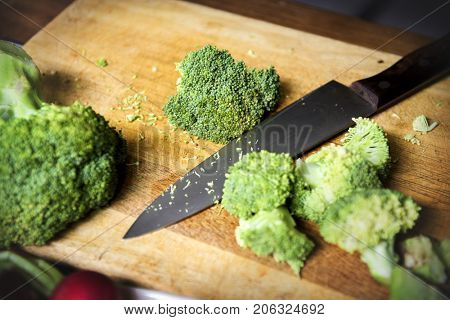 Closeup of cut fresh broccoli on cutboard