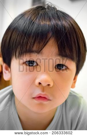 Innocent and Curious Stare from an Asian Boy