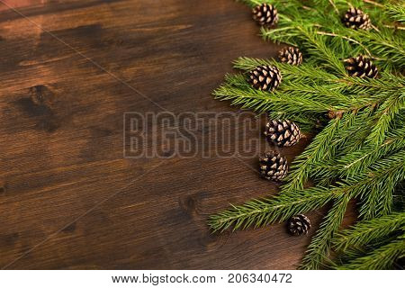 Flat Lay: Larch And Fir Branches And Pine Cones On The Wood Desk.